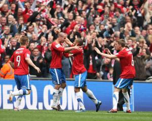 ASHLEY CHAMBERS IS CONGRATULATED AFTER PUTTING CITY LEVEL