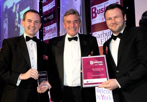 Ken Hesketh (centre), Chief Executive of Benenden Healthcare Society, presents the Best Business and Community Link Award to Mark Leyland (left) and Colin Swanston of York Marriott Hotel.