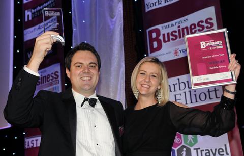 James Buffoni and Zoe Hemingfield, of the Ryedale Group, on stage to receive The Press Business of the Year Award.