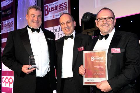 East Coast's Andy Meadows (centre) presents the Large Business of the Year Award to Derek Burrows (left) and Norman Revill of York Mailing Ltd.