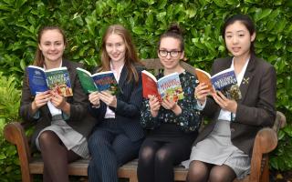 Boarders at St Peter's School (l-r): Hope, Anna, Ester and Isabel, with copies of Enid Blyton's Malory Towers. The school is sponsoring an upcoming production of the classic boarding school stories at York Theatre Royal in SeptemberPicture: Frank