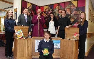 Pupils from Year 10 at Archbishop Holgate’s School, with, from left, the school chaplain Richard Nihill, the Bishop of Selby, the Right Rev John Thomson, Laura Hagues, the manager of York Foodbank  and the vicar of Heslington, the Rev Jan Nobel