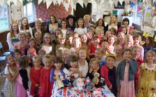 Osbaldwick & Murton Brownie pack enjoy their royal wedding party, complete with knitted figures of the royal family