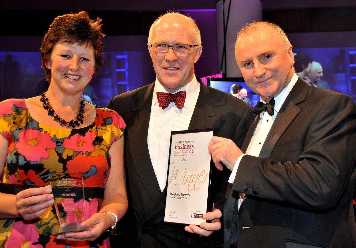Tom and Gill Mellor, of Wold Top Brewery, at Wold Newton, the winners of the York Press Business of the Year title, receive their award from Simon Nellar, of Hethertons LLP Solicitors, at last night’s awards ceremony at York Racecourse