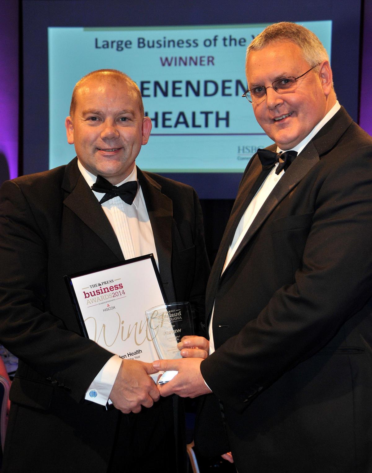  Jonathan Rutter from HSBC North Yorkshire & Humber Corporate Banking, right, presents the award for Large Business of the Year to Benenden Health’s chief executive Marc Bell