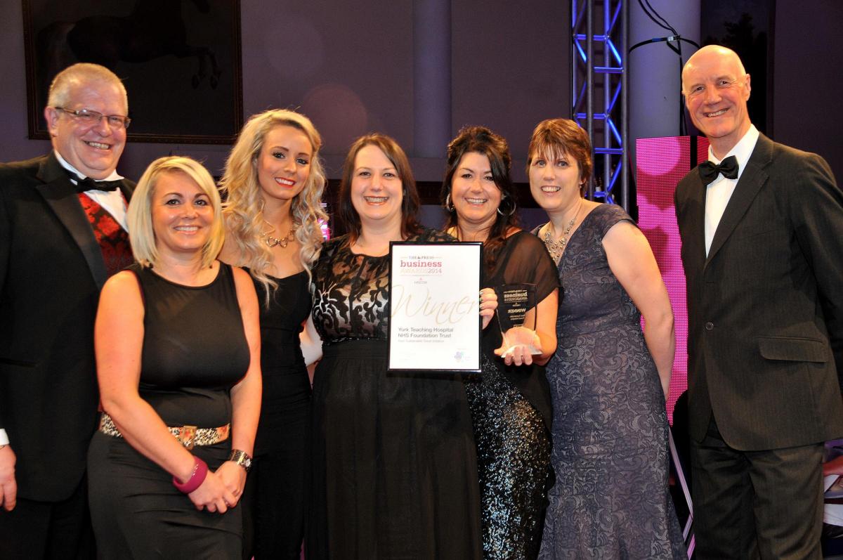  York Teaching Hospital NHS Foundation Trust, represented by, from left, Nigel Booth, Alison Goude, Laura Hill, Mandy Gambers, Sarah Hogan and Jen Bennison, receive the Best Sustainable Travel Initiative award from David Short, right, of sponsors iTravel 