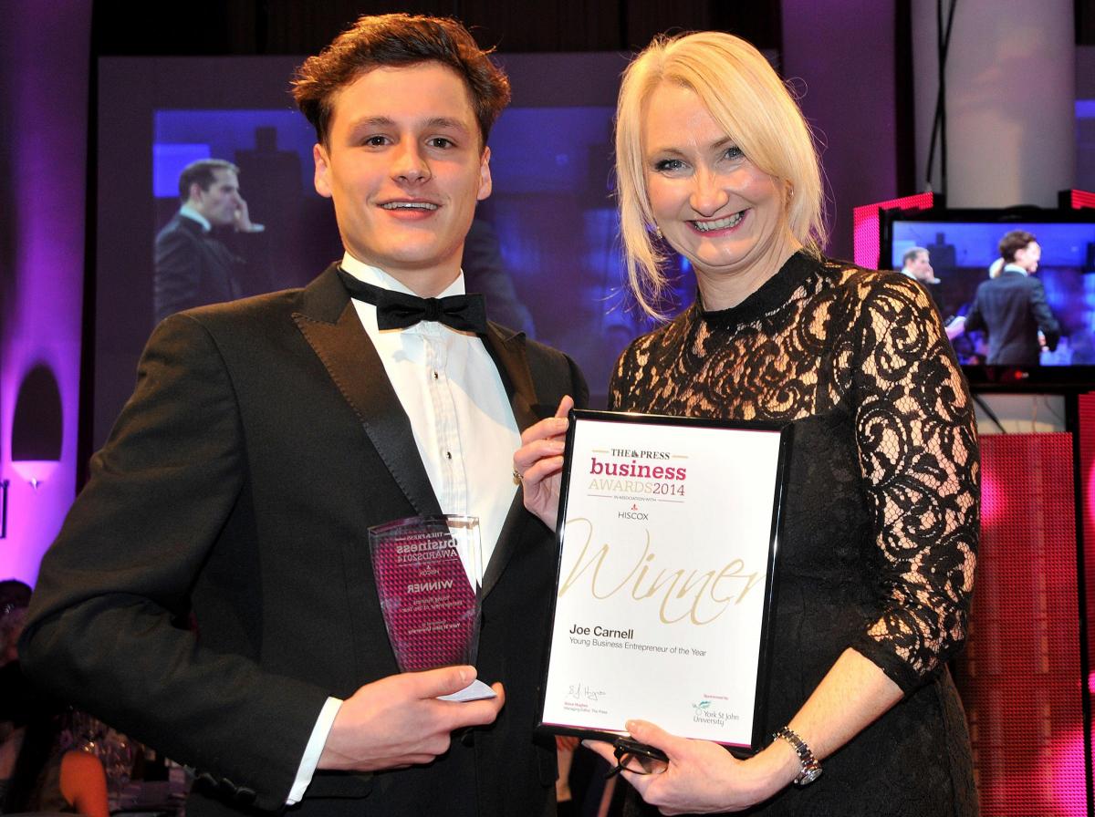 Young Entrepreneur of the Year winner Joe Carnell receives his award from Sue Reece, of sponsors York St John University
