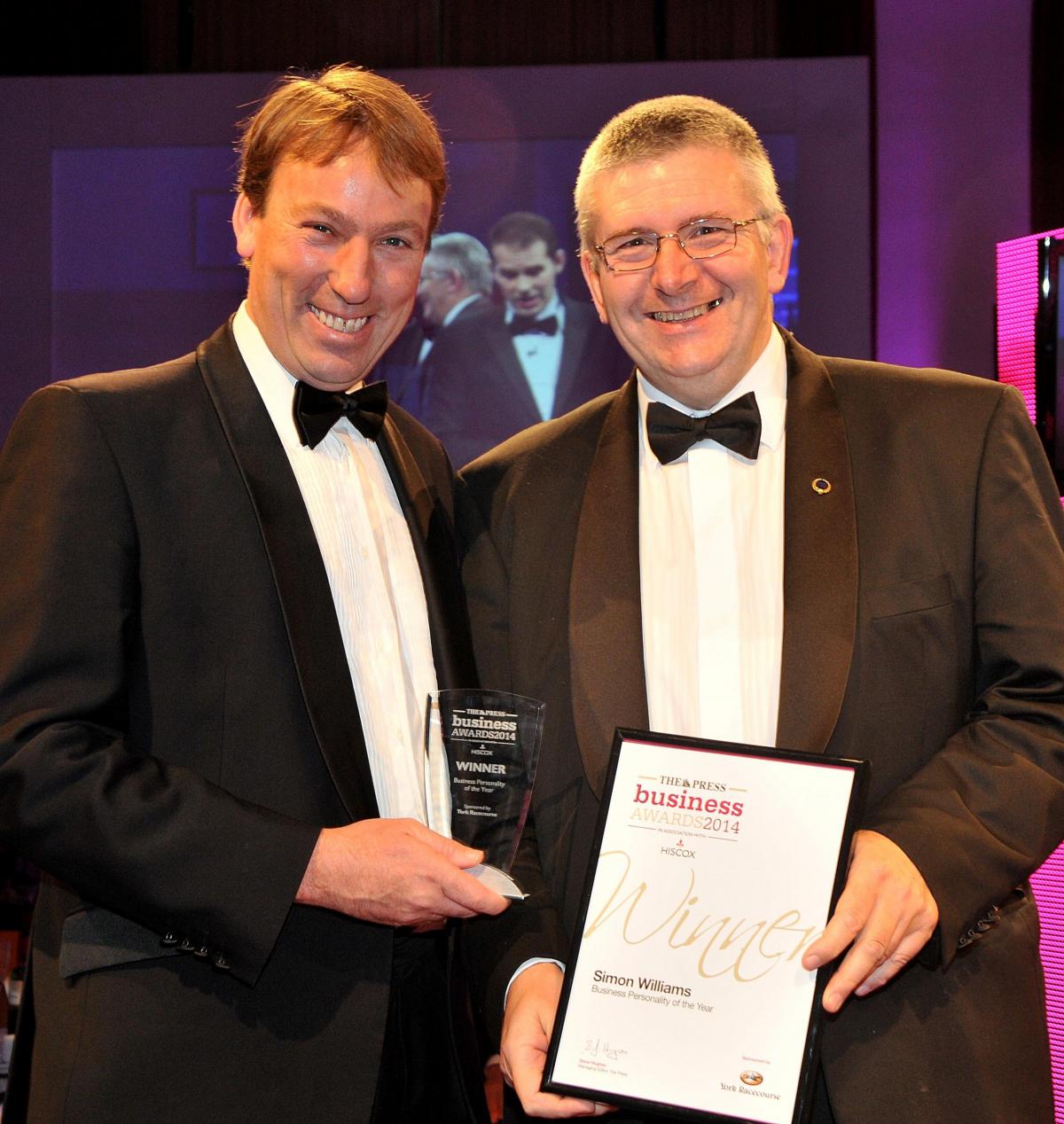 Simon Williams, right, receives his Business Personality of the Year award from William Derby, chief executive and clerk of sponsors York Racecourse