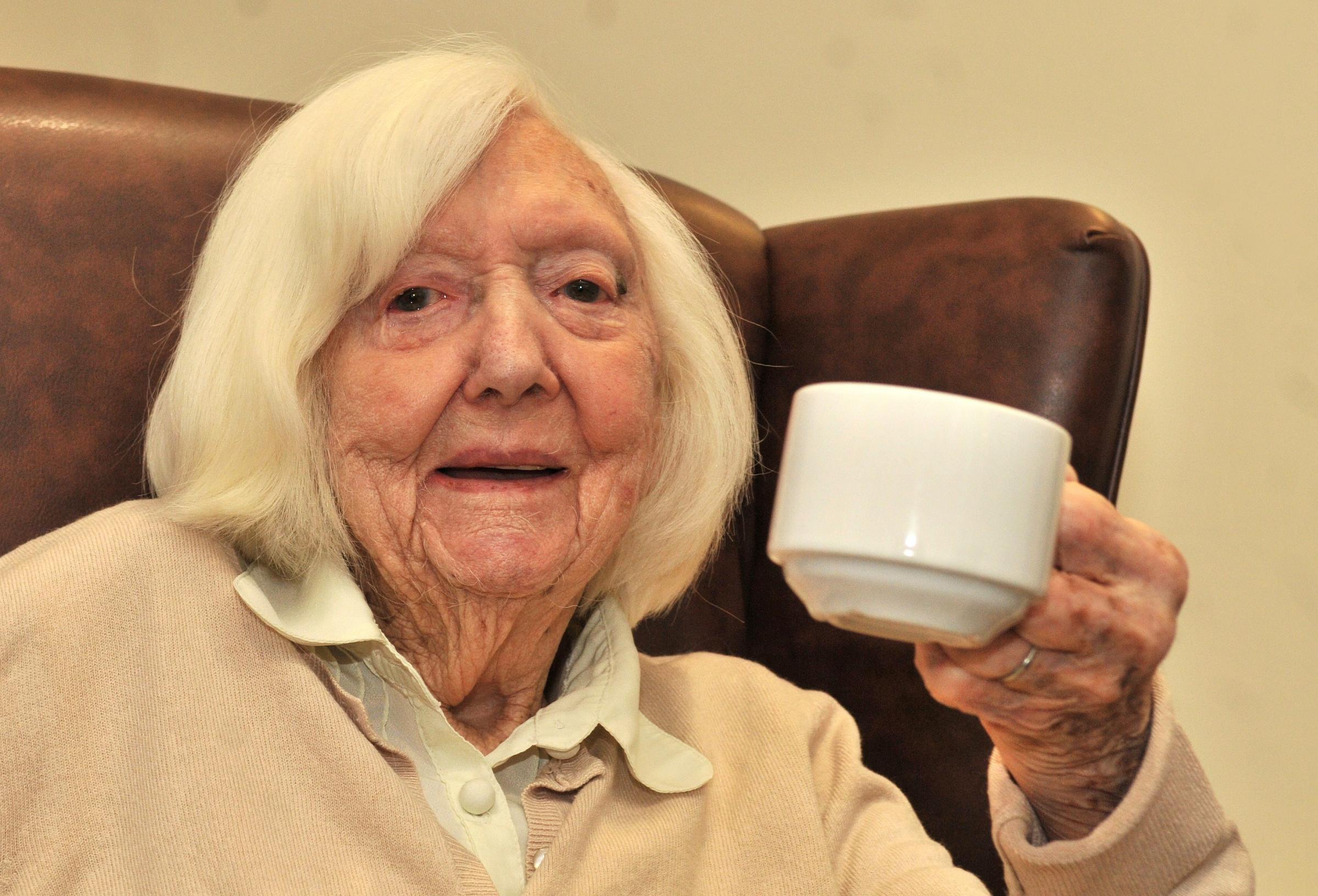Olive Bates celebrates her 103rd birthday with a cuppa (and two sugars!) at - 3481566