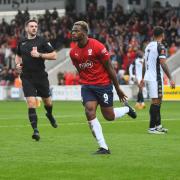 Dipo Akinyemi celebrates his opener in York City's 2-2 draw with Bromley.