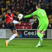York City claimed a late point in a 1-1 draw with Halifax Town thanks to Paddy McLaughlin's stoppage-time strike.