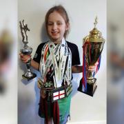 Eight-year-old Tillie has amassed many medals and trophies from her bouts