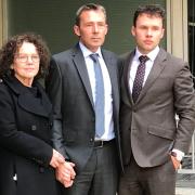 Derek Martindale with his wife Margaret, and son John outside Fleetbank House in central London for the Infected Blood Inquiry in 2019