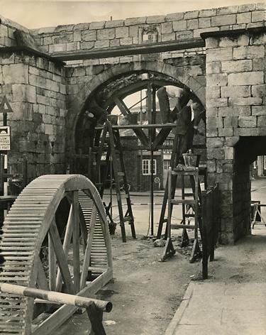 7/7/61 -  Traffic was diverted during the restoration of George Street Bar. Stonemasons replaced weathered stonework with re-cut old stones and the structure was cement grouted.