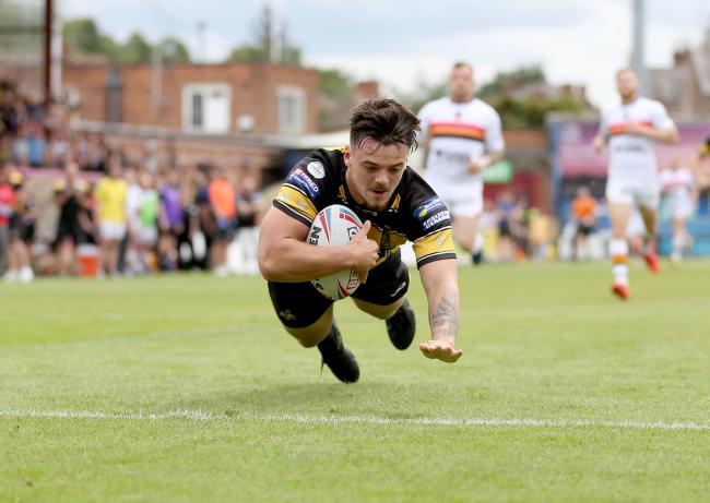 York City Knights' Will Oakes dives in to score against Bradford Bulls. Picture: Gordon Clayton