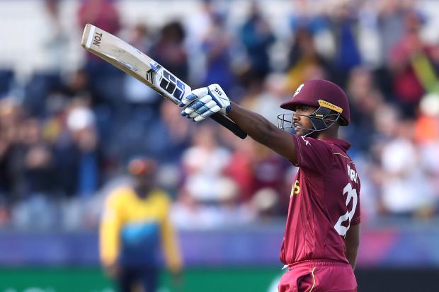 West Indies' Nicholas Pooran celebrates reaching his century during the ICC Cricket World Cup group stage match against Sri Lanka at The Riverside Durham. Picture: Owen Humphreys/PA Wire