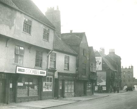 Micklegate in the 1950s. From the left the shops are Coomes footwear and repairs, a café, and at 93, Micklegate, Hobsons. 