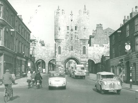This picture of Micklegate Bar from 1962 shows clearly how much the volume of traffic has escalated. The sign on top of the truck advertises 'Concrete Services.'