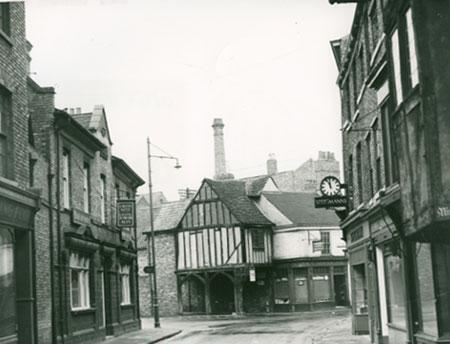 This view of Goodramgate is undated but the interesting feature here is the chimney that no longer exists.  To the left of the Cross Keys pub is a shop called Fung Foo, and the shop opposite with the clock was called Steigmanns.