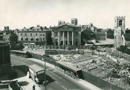 August 1963 and work is going ahead on the new Stonebow.  The business to the left of the impressive Methodist building (as you view it) was then occupied by Whitby Oliver and Son Ltd, upholsterers.