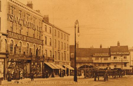Parliament Street facing the direction of Piccadilly (taken around 1902 to 1906) showing buildings (that no longer exists) that traded as a Tea Store, a pub selling beer from Braime's Tadcaster Breweries Ltd, and Isaac Poad, the corn merchant.