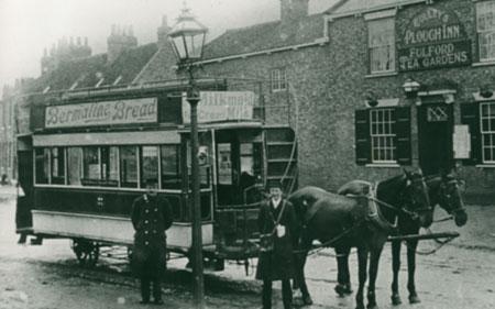 This picture of a horse-drawn tram was taken in 1905 outside the Plough Inn at Fulford.
The advert on the side of the tran promotes Bermaline Bread.