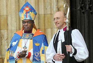 The new Bishop of Whitby, Martin Warner, after his consecration at York Minster, with the Archbishop of York, Dr John Sentamu