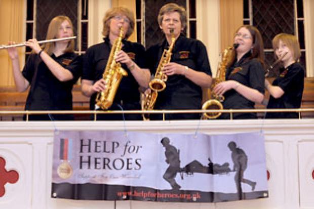 Members of Generation Groove tune up before the start of the Help For Heroes fundraising concert, in memory of Matthew Hatton, which was held at Haxby Methodist Church.