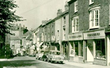 Walmgate, date unknown.  The shop on the right traded as F. C. Chalk & Sons, Furnishers.