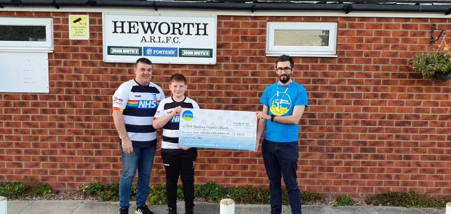 Heworth chairman Lee Clarke (left), competition winner Freddie Wilson (centre) and Joe Fenton (right), a community fundraiser from the York Teaching Hospital.