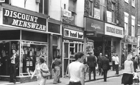 1979 and The Evening Press reports that 23-31 Coney Street are to be sold by auction.  At the time they housed the businesses of (from left to right) Discount Menswear (with a jacket on offer at £4.95) the Heel Bar, Karisma, Bostock Records, and Strand.