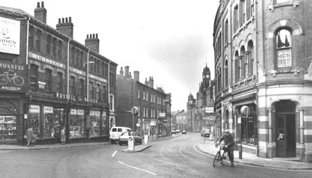 10.20am in Clifford Street, York in 1987.  Russell for Raleigh bike shop is on the left, and on the right Stanfield's sign advertising the fact that the SS Empire (now the Grand Opera House) is for sale.