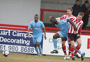 York City defender Djoumin Sangare is held back by Alty’s Anthony Danylyk. Picture: Gordon Clayton