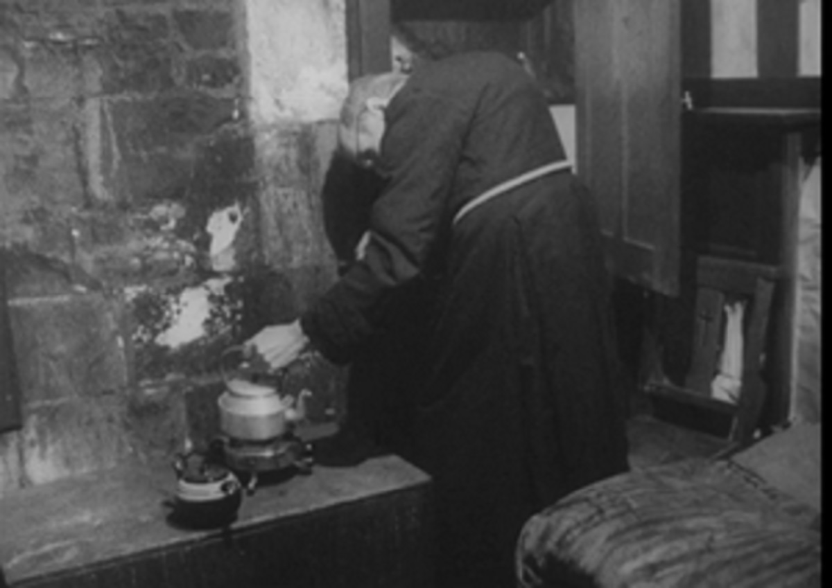 Brother Walter puts the kettle on inside his tiny home by All Saints Church in York