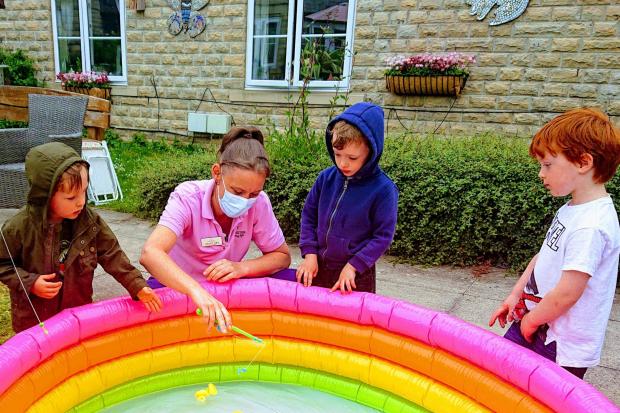 Children from Red Kite Nursery enjoy their day at Thistle Hill care home