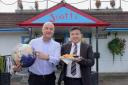 Scotts Fish and Chips proprietor Tony Webster, left, and Will Zhuang, outside the A64 chippy