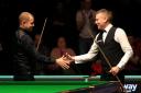 Barry Hawkins, left, is congratulated by opponent Gerard Greene after making a maximum 147 break on day two of the Betway UK Snooker Championship at the York Barbican. Picture: Simon Cooper/PA Wire