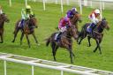 Lewis Edmunds (red and blue) wins at York Racecourse aboard Bedford Flyer. Picture: Alan Crowhurst/PA Wire