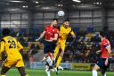 York City winger Olly Dyson wins a header. Picture: Tom Poole