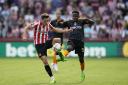 Brentford's Aaron Hickey (left) and Leeds United's Luis Sinisterra battle for the ball during the Premier League match at the Gtech Community Stadium, London. Picture: Andrew Matthews/PA Wire