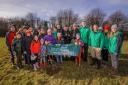 Volunteers, council staff and Forestry England workers at the woodland site