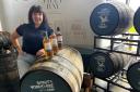 Spirit of Yorkshire Brand Ambassador Amy Teasdale with some of the gold medal whiskies