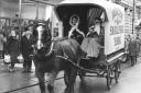 Father Christmas takes a ride in a horse-drawn delivery van from the Hunter & Smallpage store in York in 1975