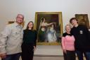 Randy Etty (left) and his family come face to face with York Art Gallery’s noted William Etty painting ‘Getting Ready for the Fancy Dress Ball’