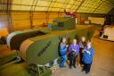 (L to R) Lynn Hart, Hazel Barker, Carol Dunkley, Sandra Searle and Stuart Martin beside the knitted tank. Picture: SWNS