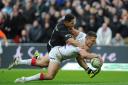 Flashback to last year’s World Cup semi-final against New Zealand, where England’s Sam Burgess scores a try under pressure from New Zealand’s Roger Tuivasa-Sheck