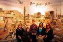 Choir members Linda James, Hazuki Mogan, Eleanor Cunnington, Shino Mogan and Victoria Dibbs pictured inside the Castle Museum's World War One Exhibition where they are to sing.