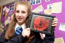 Huntington School pupil Alice Fox, 13, with her prize of an iPad after winning The Press’s secondary school First World War poetry competition with her entry, Lest We Forget