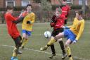 IN THE THICK OF IT: Joe Crosby (centre, in red) was one of the architects of York's 3-1 win over Leeds