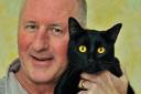 FARFLUNG FELINE: Paul Cordock reunited with Howie at home in Strensall in 2015             Picture:Nigel Holland